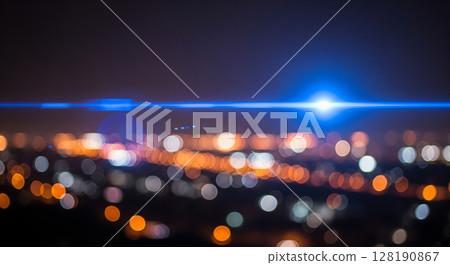 Abstract blue anamorphic lens flare overlaying blurry city night background, beautiful cinematic light effect with amazing colorful festive bokeh Abstract blue anamorphic lens flare overlaying blurry city night background, beautiful cinematic light effect with amazing colorful festive bokeh 128190867