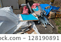Bulky trash placed in a disorganized manner 128190891