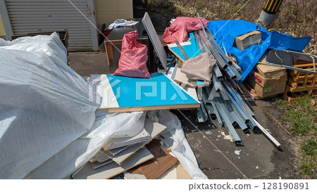 Bulky trash placed in a disorganized manner 128190891
