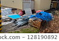 Bulky trash placed in a disorganized manner 128190892
