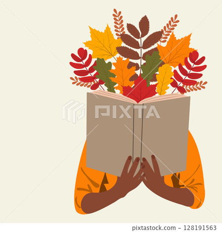 African american book lover hiding behind a book.  128191563