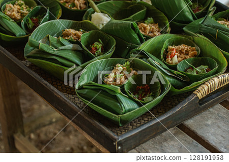 Traditional Thai Food Served in Banana Leaf Cups Traditional Thai Food Served in Banana Leaf Cups 128191958