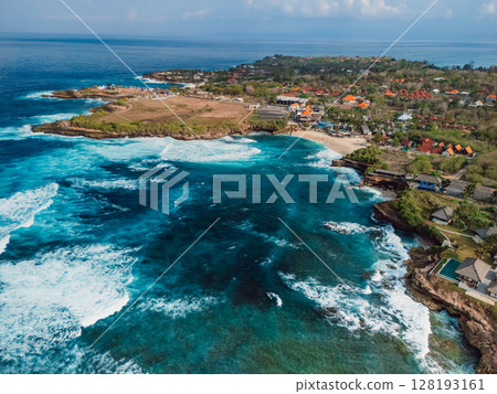 Coastline with crashing waves in ocean on Nusa Lembongan island, drone view 128193161
