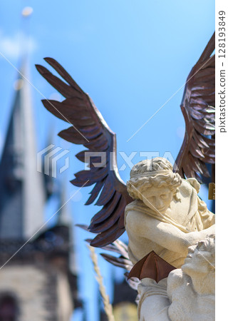 Architecture details on the Marian column, religious statue of the Virgin Mary in Old Town Square of Prague, Czech Republic Architecture details on the Marian column, religious statue of the Virgin Mary in Old Town Square of Prague, Czech Republic 128193849