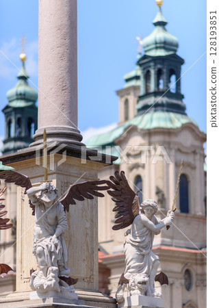 Architecture details on the Marian column, religious statue of the Virgin Mary in Old Town Square of Prague, Czech Republic Architecture details on the Marian column, religious statue of the Virgin Mary in Old Town Square of Prague, Czech Republic 128193851
