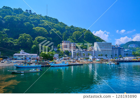 View of the west side from near Atami Port in Atami City, Shizuoka Prefecture (Atami Port, fishing boats, resort hotels, etc.) 128193890