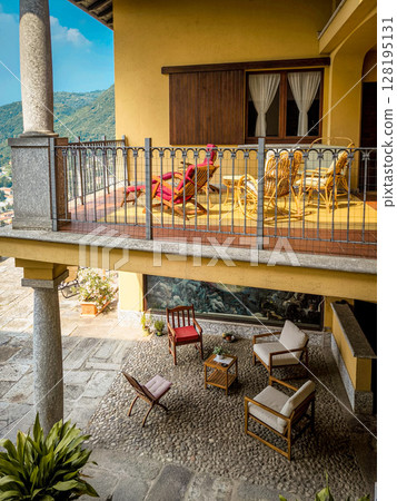 Elegant Italian Courtyard With Traditional Architecture: Cozy Outdoor Lounge And Balcony In A Lombardy Villa 128195131