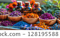 Assortment Of Colorful Spices And Dried Herbs In Wooden Bowls On Dark Stone Background: Aromatic Culinary Ingredients With Basil Leaves Cinnamon Sticks And Peppercorns Arranged For Cooking And Kitchen 128195588