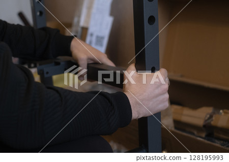 Assembling sports equipment at home for convenient and organized home fitness workouts and exercise routines. 128195993