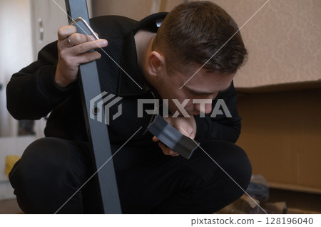 Furniture repair and assembly specialist updates furniture at home without the need for removal or extra hassle. Furniture repair and assembly specialist updates furniture at home without the need for removal or extra hassle. 128196040