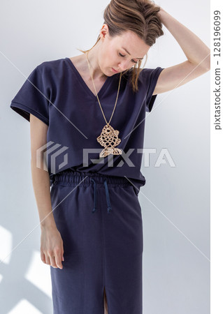 Beautiful woman in black dress on white background. Fashionable female style. Studio photography. Vertical photo. High quality photo Beautiful woman in black dress on white background. Fashionable female style. Studio photography. Vertical photo. High quality photo 128196099