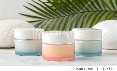Ombre style skincare jars arranged artistically on a marble surface with tropical greenery 128196148