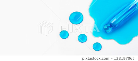 Drops of cosmetics and a pipette on a white background. 128197065