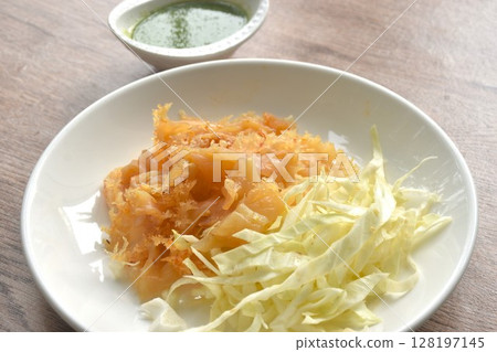 boiled jellyfish with slice cabbage on plate dipping Thai spicy and sour seafood sauce boiled jellyfish with slice cabbage on plate dipping Thai spicy and sour seafood sauce 128197145