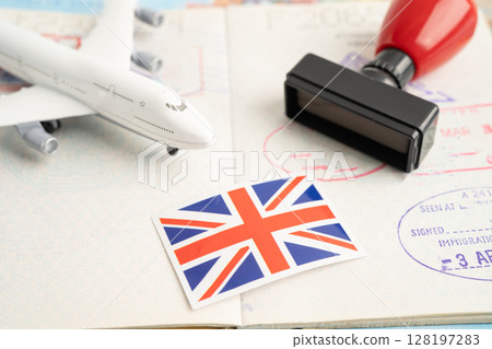 UK United Kingdom passport with approved stamp on document for tourism to immigration at airport in country. 128197283