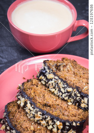 Fresh pastry made of zucchini and cup of white coffee. Delicious dessert 128197686