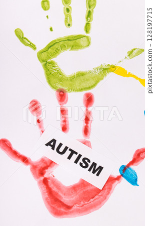 Kids handprint made of paint and inscription Autism. Autism Spectrum Disorder Kids handprint made of paint and inscription Autism. Autism Spectrum Disorder 128197715