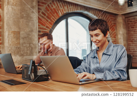 A modern coworking space designed for professionals to collaborate and innovate together A modern coworking space designed for professionals to collaborate and innovate together 128199552
