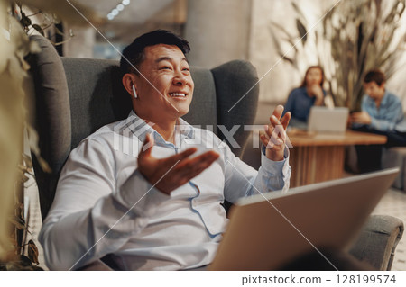 A Professional Communicator Engaged in Dynamic Virtual Meetings, Connecting with Others A Professional Communicator Engaged in Dynamic Virtual Meetings, Connecting with Others 128199574