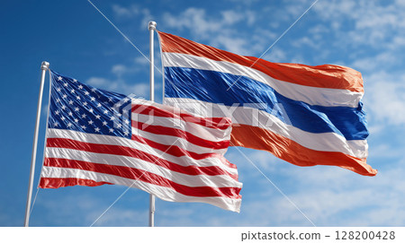 American and Thai flags waving together against clear blue sky, symbolizing international friendship 128200428