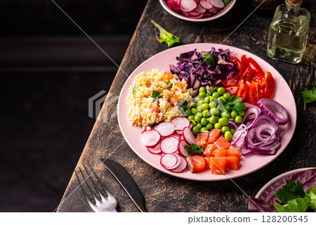 Balanced healthy bowl with vegetables and salmon 128200545
