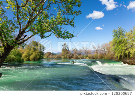Beautiful natural landscape of Manavgat waterfall in national park on sunny spring day. Unique azure water color with splashes, Side, Antalya,Turkey. High quality photo Beautiful natural landscape of Manavgat waterfall in national park on sunny spring day. Unique azure water color with splashes, Side, Antalya,Turkey. High quality photo 128200697