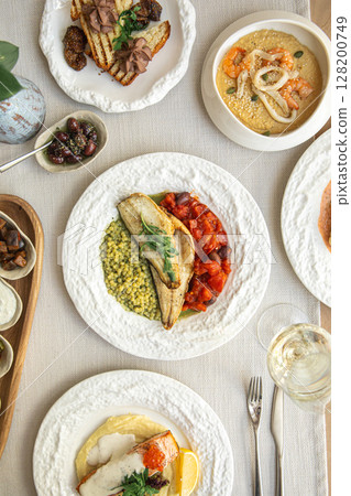 Assorted gourmet dishes with vegetables seafood 128200749