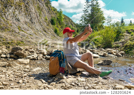 Senior Woman Taking a Selfie on a Hiking Trip Senior Woman Taking a Selfie on a Hiking Trip 128201624