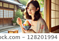 Beautiful woman eating shaved ice 128201994