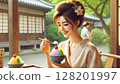 A woman in a kimono wearing sweetness in a teahouse 128201997