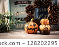 Halloween pumpkins and pine cones 128202295