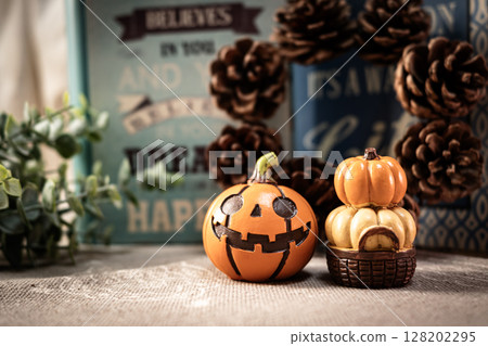Halloween pumpkins and pine cones 128202295