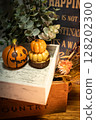 Halloween pumpkin and dried flowers 128202300