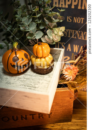 Halloween pumpkin and dried flowers 128202300