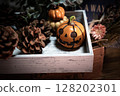 Halloween pumpkins and pine cones 128202301
