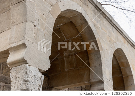 Elegant stone arches showcasing detailed craftsmanship Elegant stone arches showcasing detailed craftsmanship 128202530