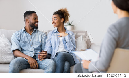 Marriage Reconciliation. Happy Black Spouses Sharing Good News With Marital Counselor. Selective Focus 128204340