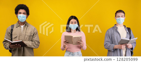 New normal, education and covid-19 pandemic. Young european, asian and african american students in protective masks read books and abstracts, isolated on orange background, copy space, studio shot 128205099