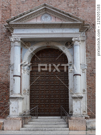 Old medieval front door at Verona, Italy. Old medieval front door at Verona, Italy. 128205188
