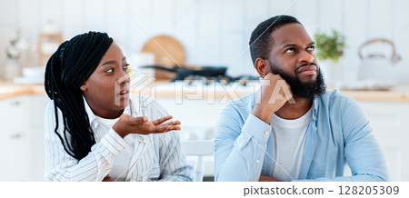 Annoyed Black Man Listening Complaints From Wife In Kitchen At Home, Millennial African American Woman Blaming Husbang For Problems In Marriage, Suffering Relationship Crisis, Copy Space 128205309