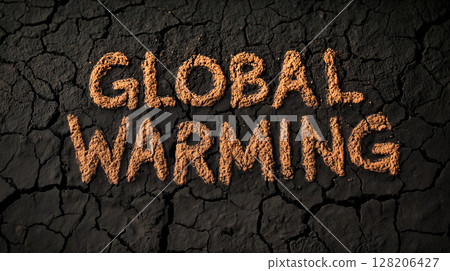 'Global warming' text on cracked earth surface highlighting environmental impact 128206427