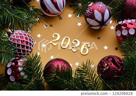 Yellow New Year's background with the number of the coming year 2026. 128206628