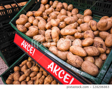 Freshly harvested potatoes displayed in a market setting showcasing their earthy texture and natural appearance promoting healthy eating concept 128206863