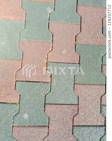Rubber pavement in a top-down style, in red-brown and grey-green colors, representing urban flooring and safety 128207712