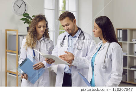 Doctors and Nurses in Hospital Office Meeting Doctors and Nurses in Hospital Office Meeting 128207847