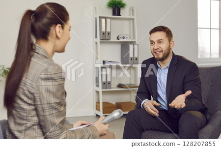 Female reporter interviewing guest speaker for podcast, radio, business talk, media show 128207855