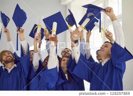 Graduation happy student ceremony formal event, young people wearing traditional academic dress 128207869