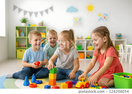 Happy Children Building with Colorful Toy Blocks on Floor Happy Children Building with Colorful Toy Blocks on Floor 128208054