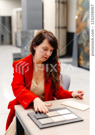 Interior designer choosing ceramic tiles for new project 128208067