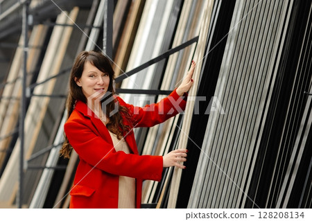 Architect choosing construction materials for new project in warehouse Architect choosing construction materials for new project in warehouse 128208134